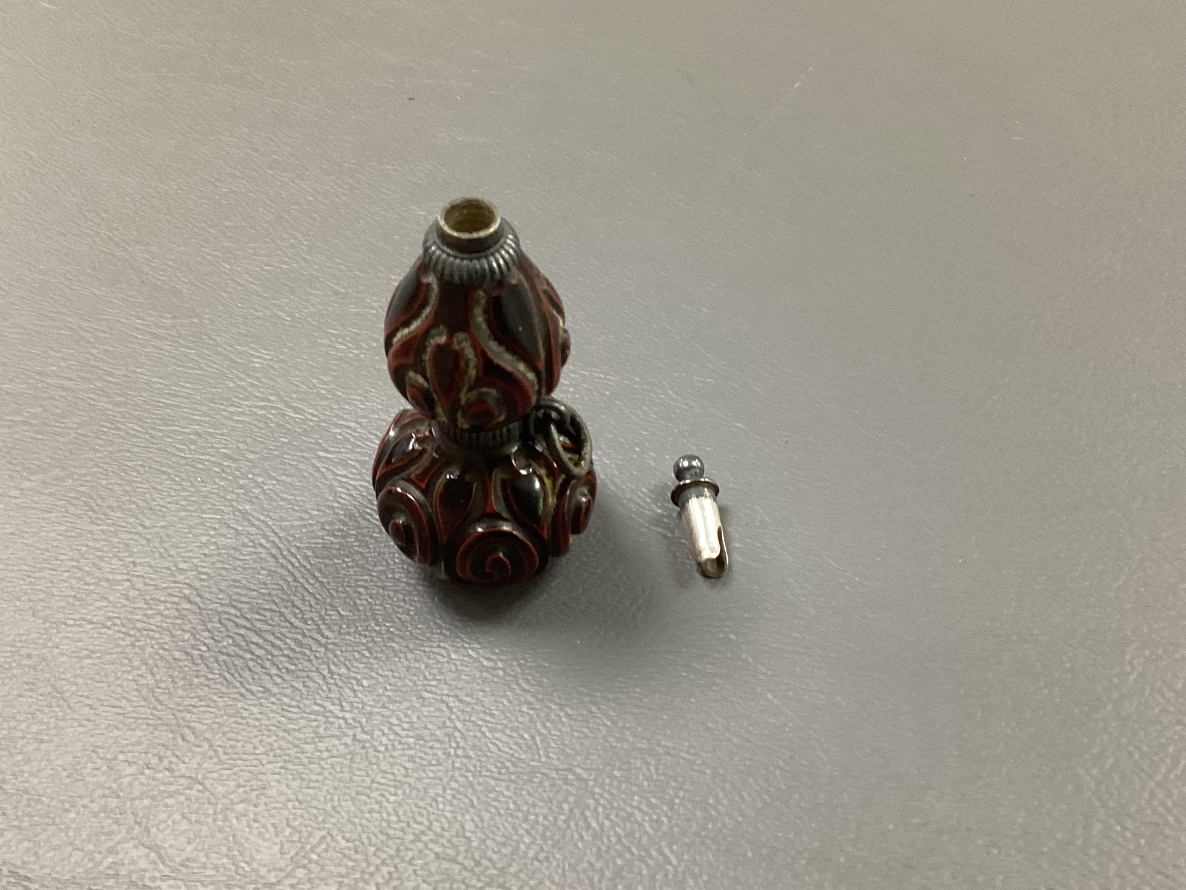 A Japanese guribori lacquer double gourd shaped netsuke, Edo period, late 18th/early 19th century